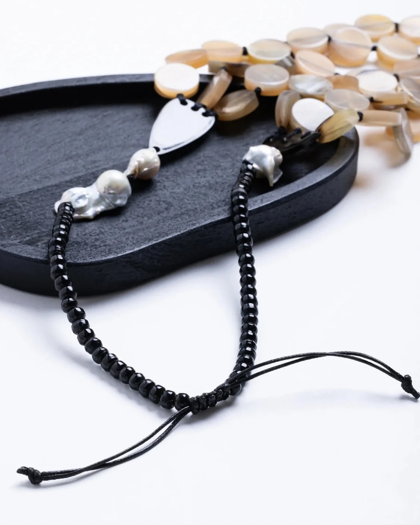 Tethered by threads, polished with purpose.

[Baroque pearls, handcrafted necklace, natural stones, black beaded jewellery, artisanal accessory, statement necklace, earthy tones, textural contrast, luxury details, sculptural design, modern heirloom, thread-tie necklace]

#maneesharuia #scarf #statementnecklace #artisanjewelry #handcraftedluxury #naturalelements #sculpural #earthyelegance #beadedbeauty #minimalluxury #wearableart